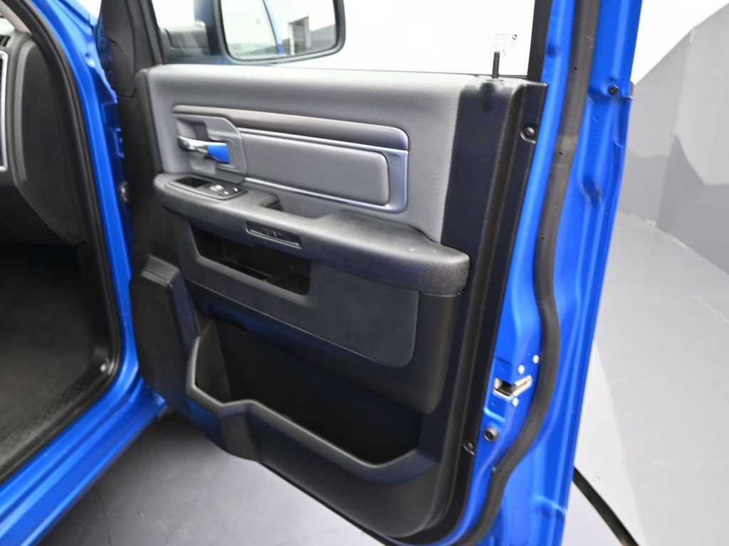 2024 Hydro Blue Pearlcoat Ram 1500 Classic SLT 4X4 Truck