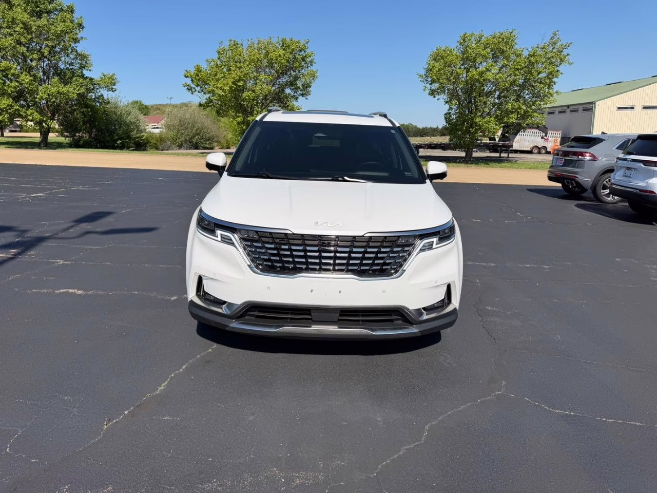2024 Snow White Pearl Kia Carnival SX Prestige FWD Van