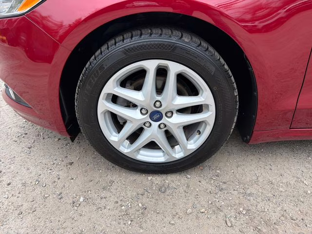 2014 Ruby Red Metallic Ford Fusion SE FWD Sedan