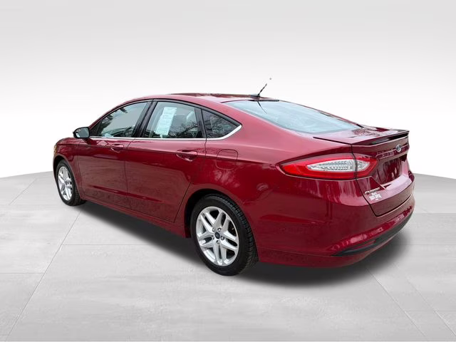 2014 Ruby Red Metallic Ford Fusion SE FWD Sedan