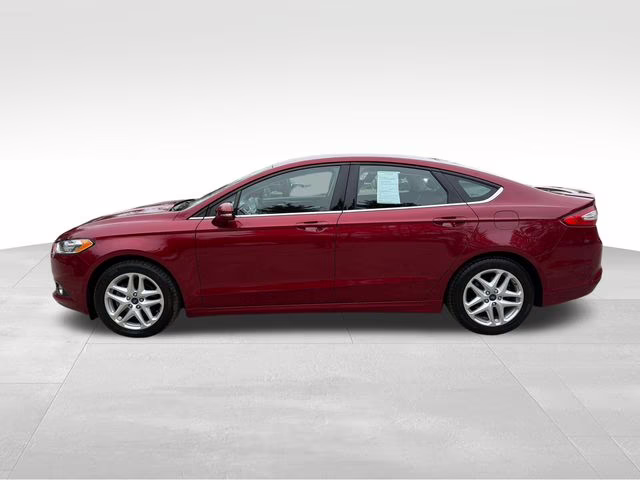 2014 Ruby Red Metallic Ford Fusion SE FWD Sedan