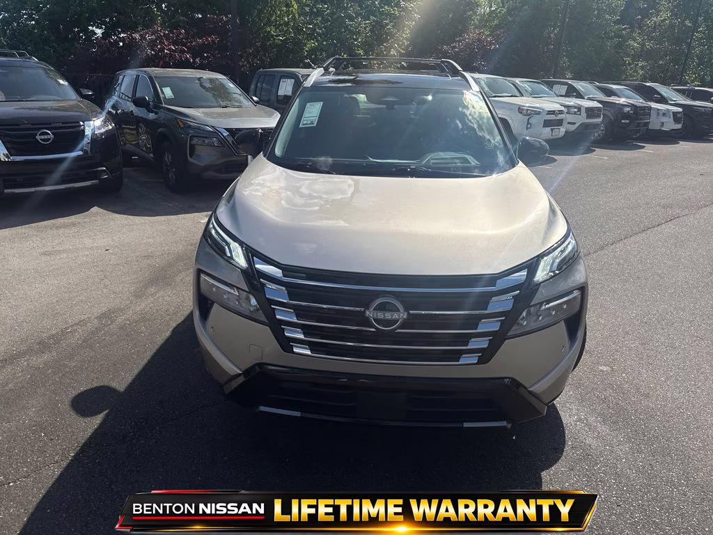 2025 Champagne Silver Metallic/Super Black Nissan Rogue Platinum FWD SUV