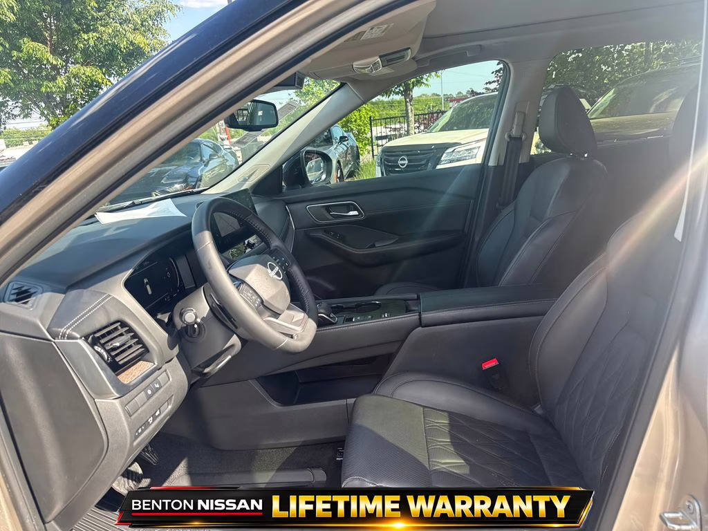 2025 Champagne Silver Metallic/Super Black Nissan Rogue Platinum FWD SUV