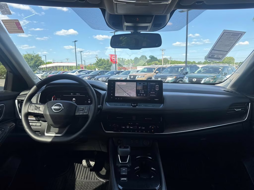 2025 Champagne Silver Metallic/Super Black Nissan Rogue Platinum FWD SUV
