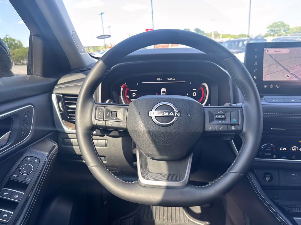 2025 Champagne Silver Metallic/Super Black Nissan Rogue Platinum FWD SUV