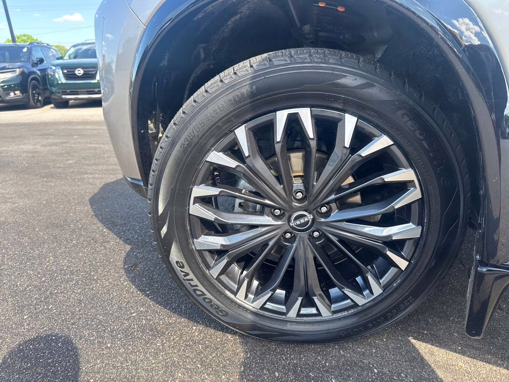 2025 Champagne Silver Metallic/Super Black Nissan Rogue Platinum FWD SUV