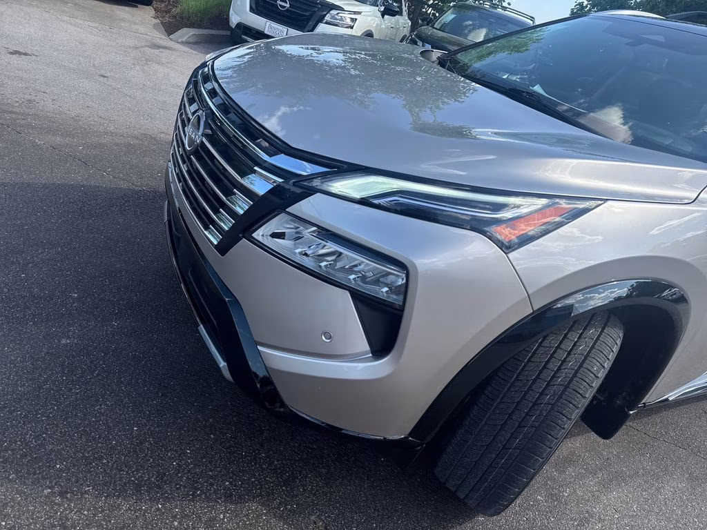 2025 Champagne Silver Metallic/Super Black Nissan Rogue Platinum FWD SUV