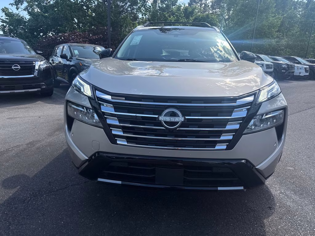 2025 Champagne Silver Metallic/Super Black Nissan Rogue Platinum FWD SUV