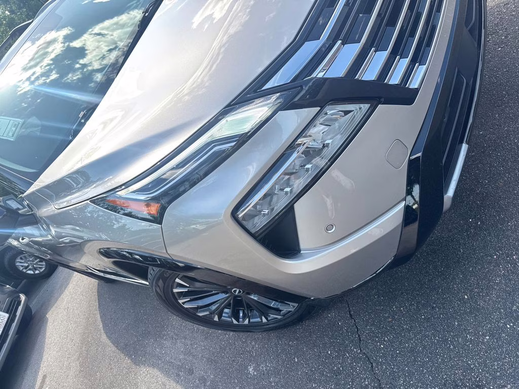 2025 Champagne Silver Metallic/Super Black Nissan Rogue Platinum FWD SUV