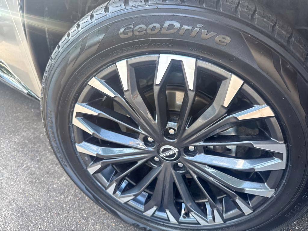 2025 Champagne Silver Metallic/Super Black Nissan Rogue Platinum FWD SUV
