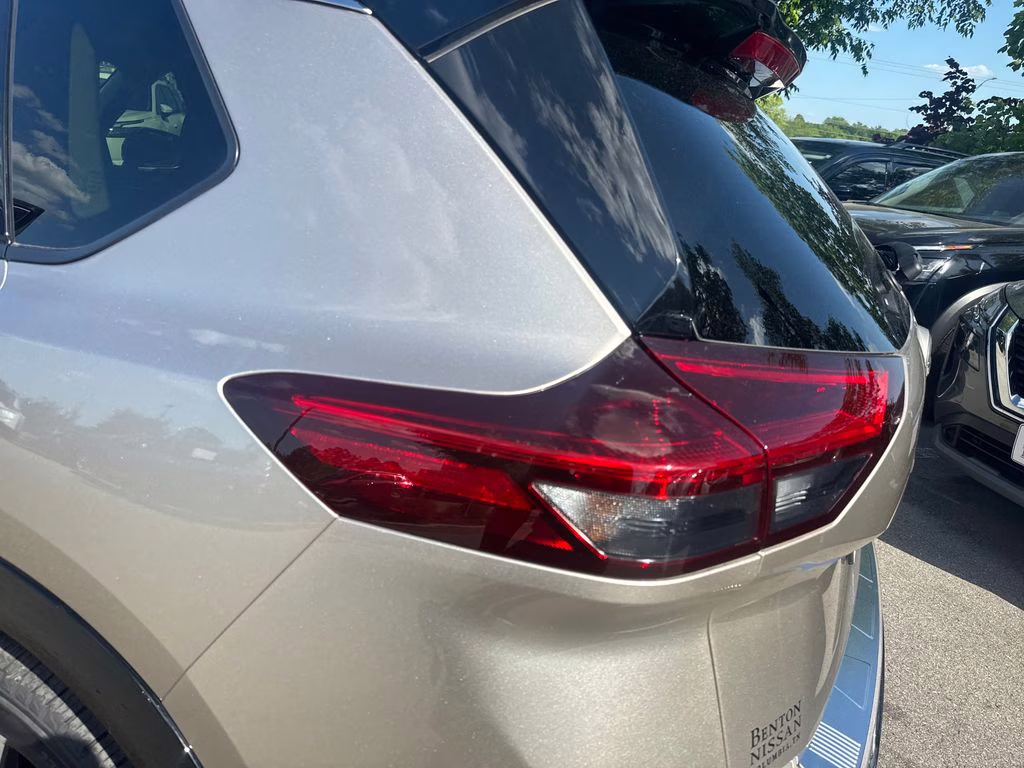 2025 Champagne Silver Metallic/Super Black Nissan Rogue Platinum FWD SUV