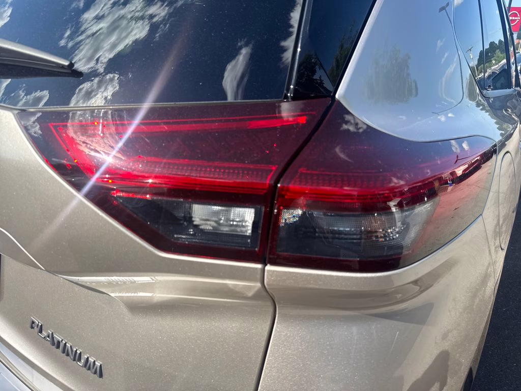 2025 Champagne Silver Metallic/Super Black Nissan Rogue Platinum FWD SUV