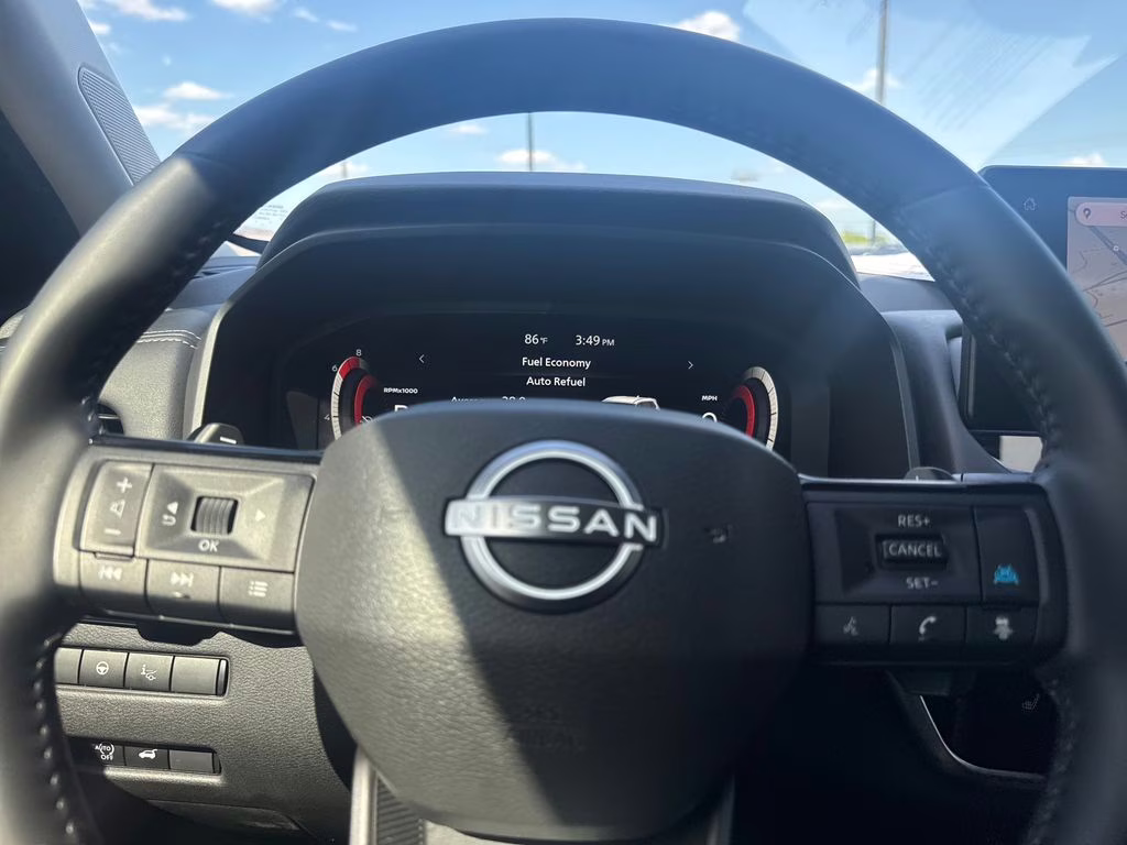 2025 Champagne Silver Metallic/Super Black Nissan Rogue Platinum FWD SUV