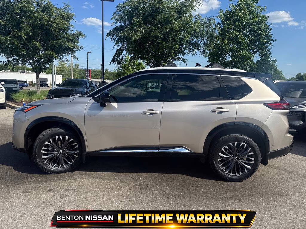 2025 Champagne Silver Metallic/Super Black Nissan Rogue Platinum FWD SUV