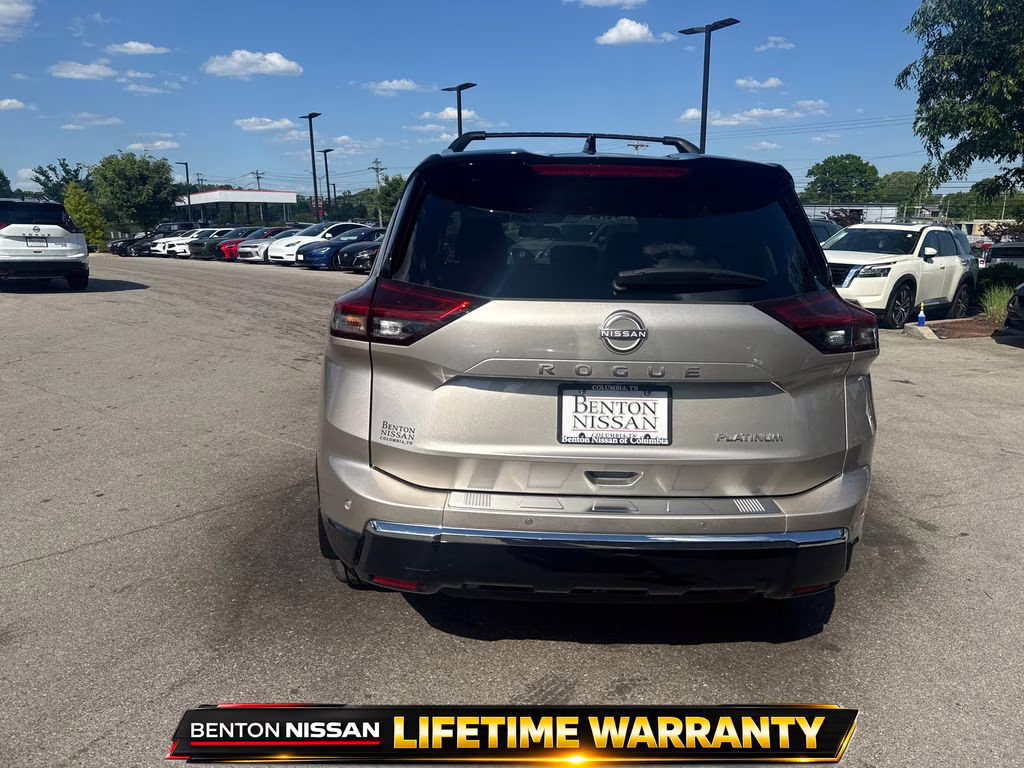 2025 Champagne Silver Metallic/Super Black Nissan Rogue Platinum FWD SUV