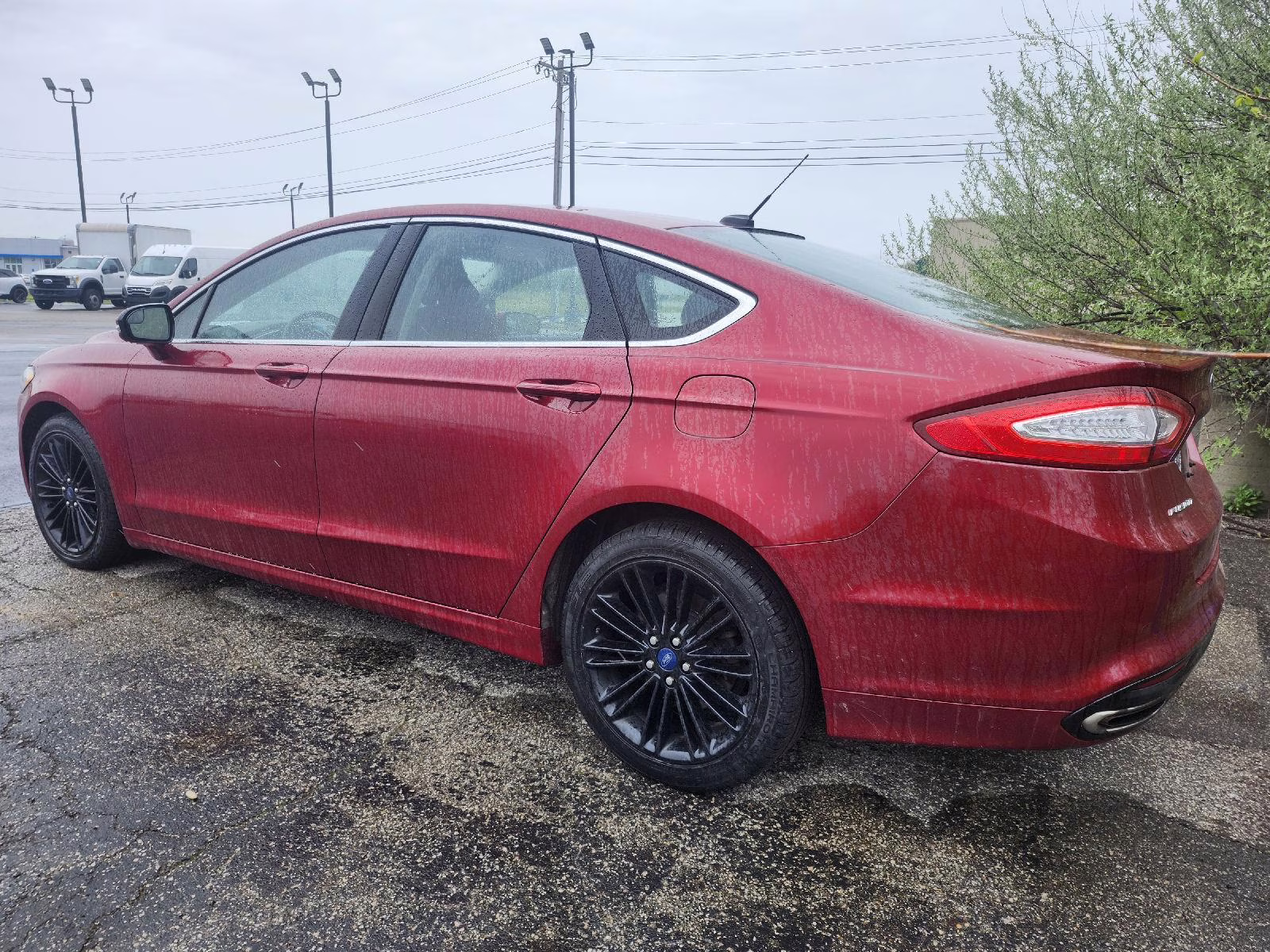 2016 Ruby Red Metallic Tinted Clearcoat Ford Fusion SE AWD Sedan