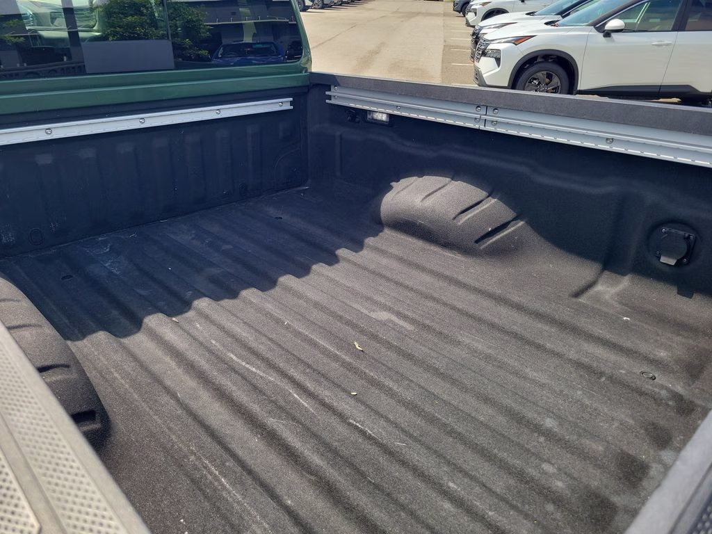 2025 Tactical Green Metallic Nissan Frontier SL 4X4 Truck