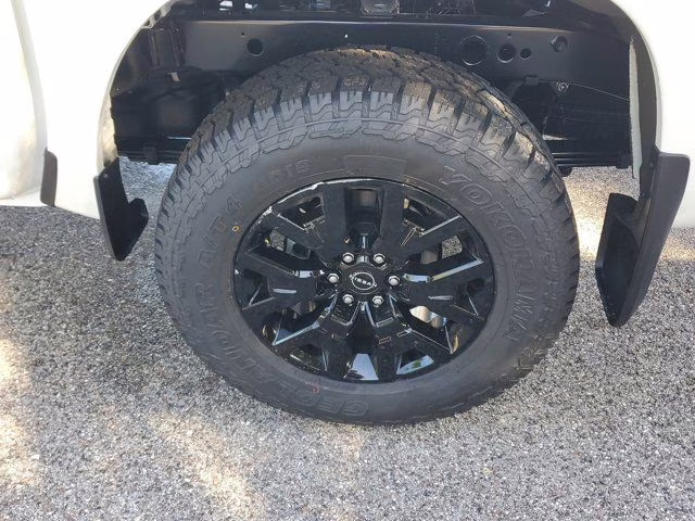 2026 Glacier White Nissan Frontier SV 4X4 Truck