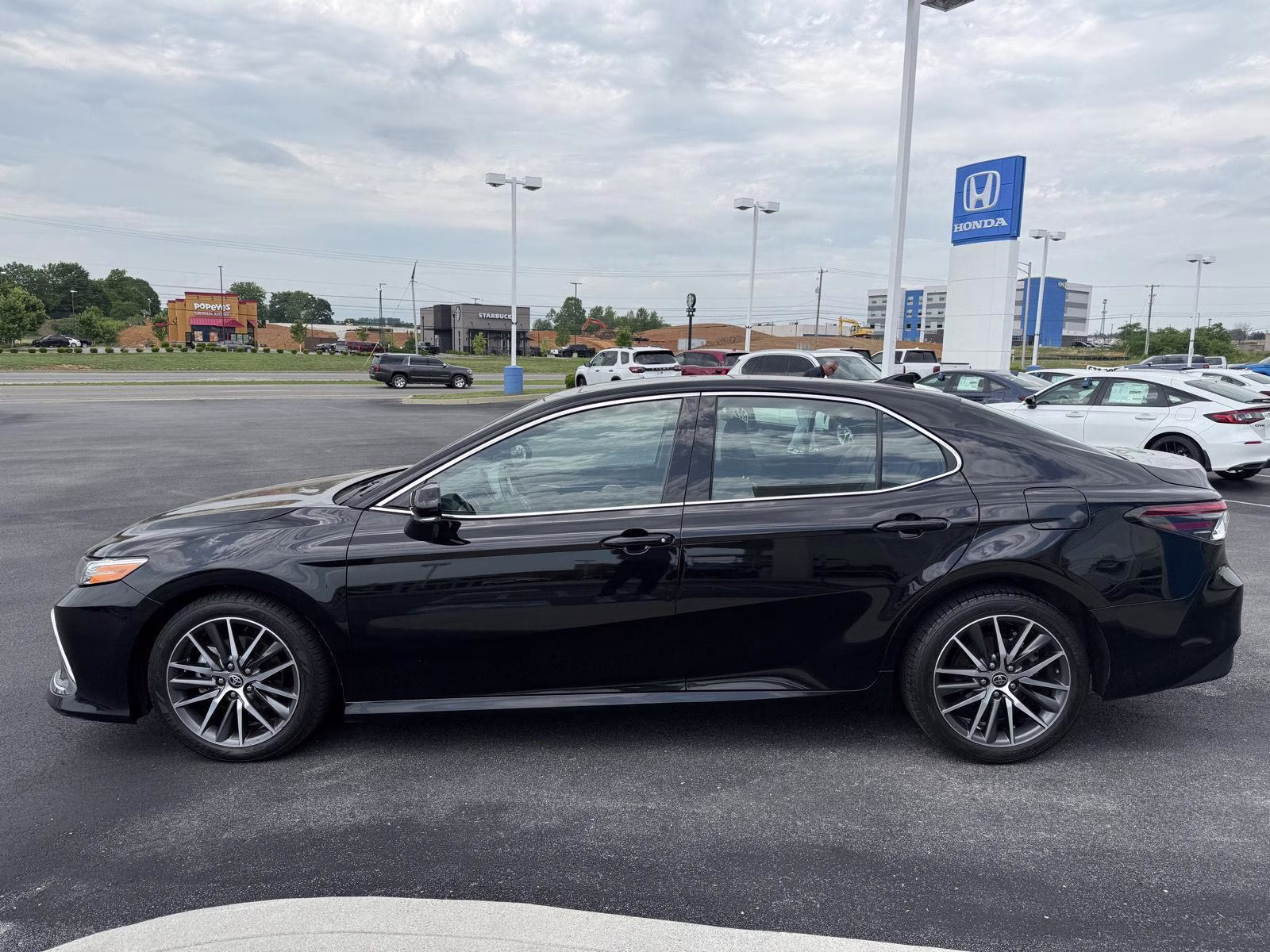 2023 Midnight Black Metallic Toyota Camry XLE V6 FWD Sedan