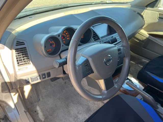 2004 Spirited Bronze Pearl Nissan Maxima 3.5 SL FWD Sedan