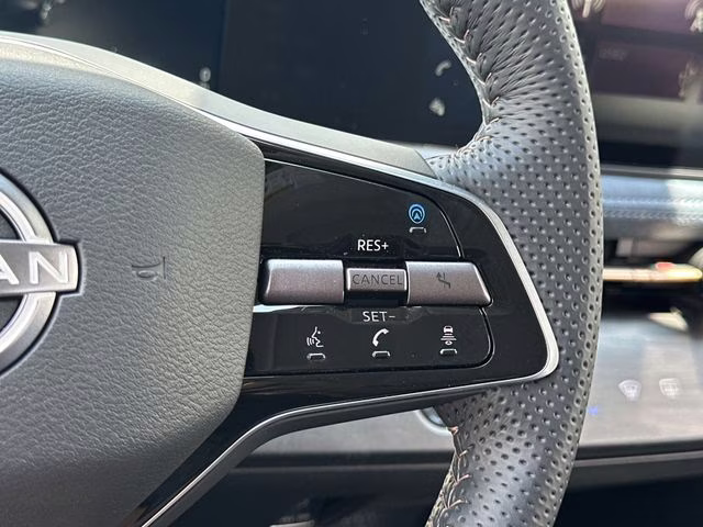 2025 Sunrise Copper Pearl/Black Diamond Pearl Nissan ARIYA PLATINUM+ e-4ORCE AWD SUV