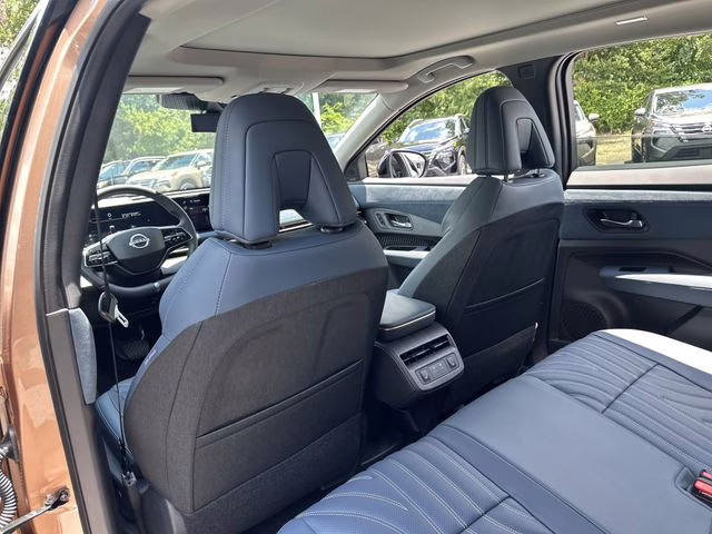 2025 Sunrise Copper Pearl/Black Diamond Pearl Nissan ARIYA PLATINUM+ e-4ORCE AWD SUV