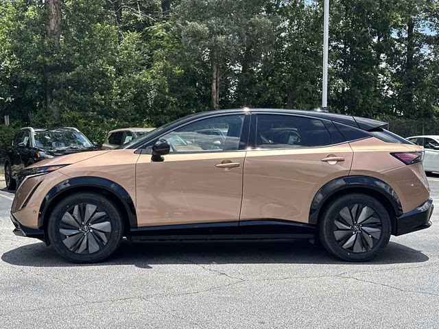 2025 Sunrise Copper Pearl/Black Diamond Pearl Nissan ARIYA PLATINUM+ e-4ORCE AWD SUV