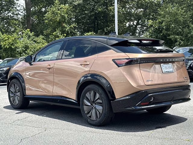 2025 Sunrise Copper Pearl/Black Diamond Pearl Nissan ARIYA PLATINUM+ e-4ORCE AWD SUV