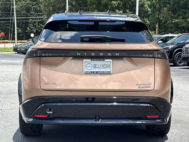 2025 Sunrise Copper Pearl/Black Diamond Pearl Nissan ARIYA PLATINUM+ e-4ORCE AWD SUV
