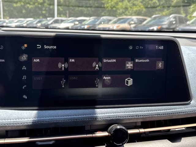 2025 Sunrise Copper Pearl/Black Diamond Pearl Nissan ARIYA PLATINUM+ e-4ORCE AWD SUV