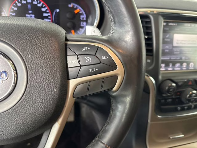 2015 Billet Silver Metallic Clearcoat Jeep Grand Cherokee Altitude 4X4 SUV