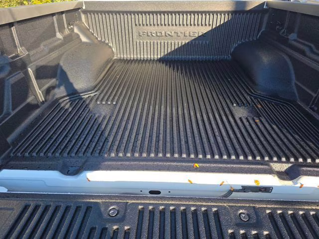 2026 Glacier White Nissan Frontier SV 4X4 Truck