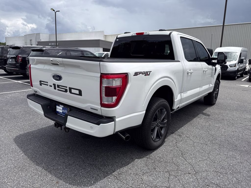 2023 Star White Metallic Tri-Coat Ford F-150 Lariat 4X4 Truck