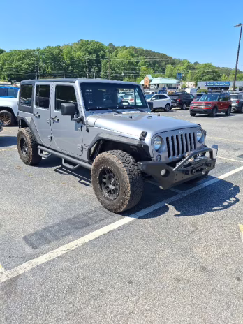 2015 Billet Silver Metallic Clearcoat Jeep Wrangler Unlimited Sport 4X4 SUV