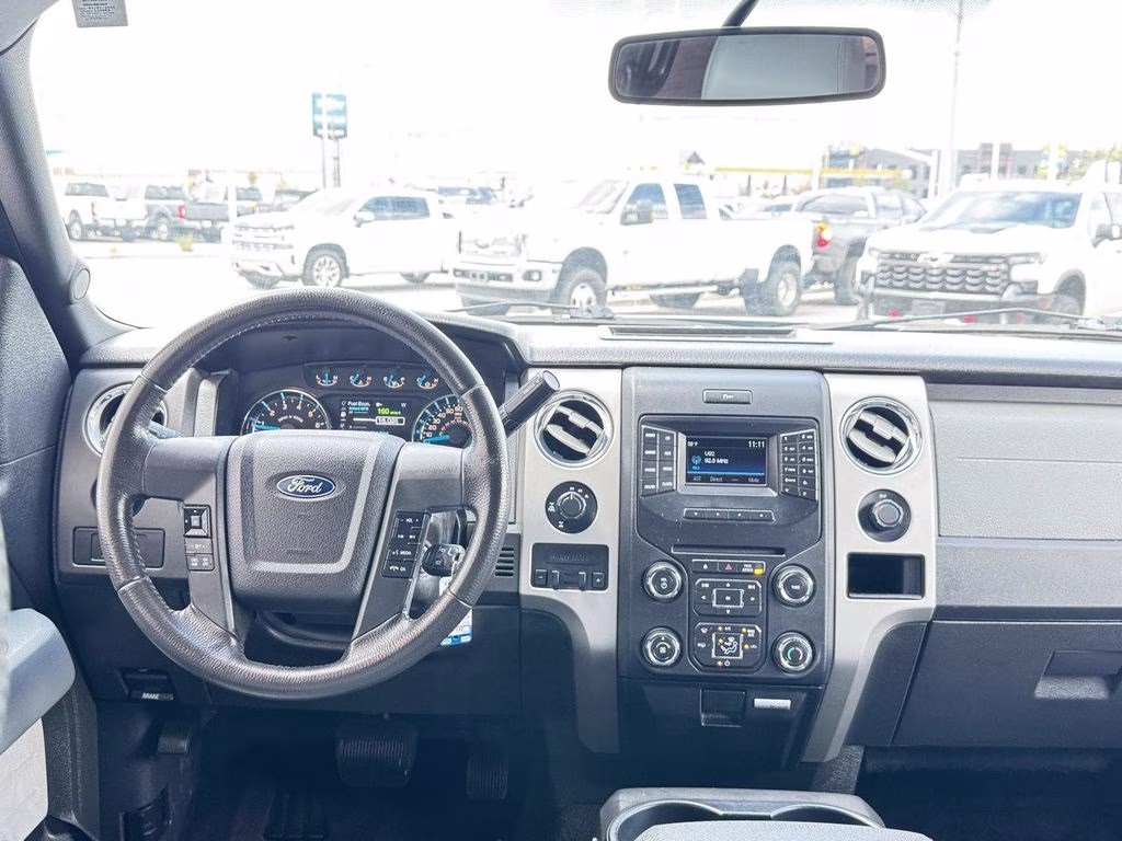 2014 Tuxedo Black Metallic Ford F-150 XLT 4X4 Truck