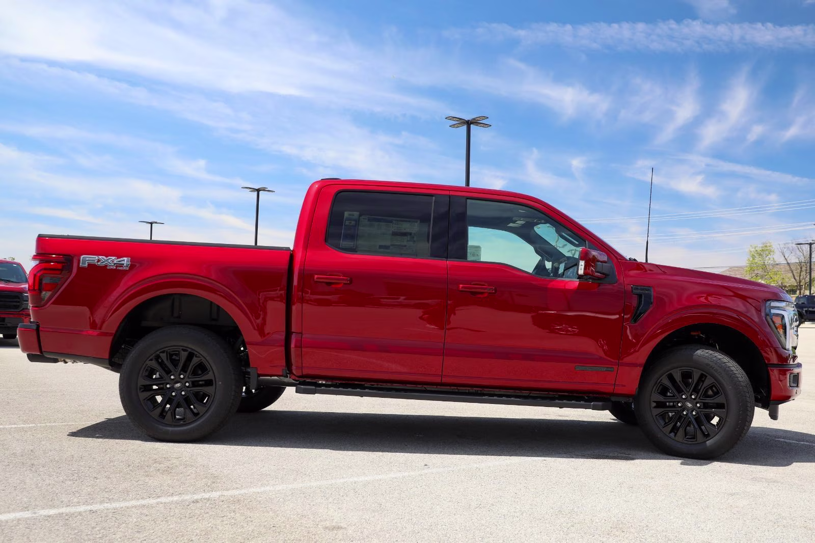2026 Ruby Red Metallic Tinted Clearcoat Ford F-150 LARIAT 4X4 Truck