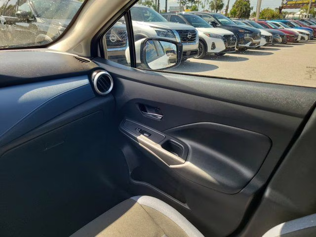 2024 Aspen White Tricoat Nissan Versa 1.6 SV FWD Sedan