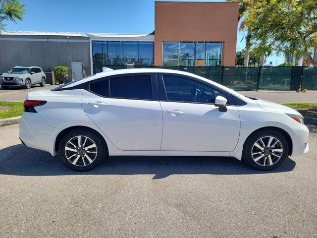 2024 Aspen White Tricoat Nissan Versa 1.6 SV FWD Sedan