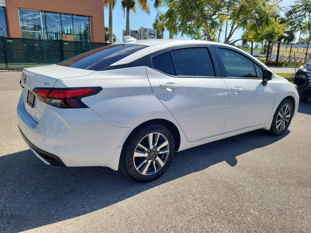 2024 Aspen White Tricoat Nissan Versa 1.6 SV FWD Sedan