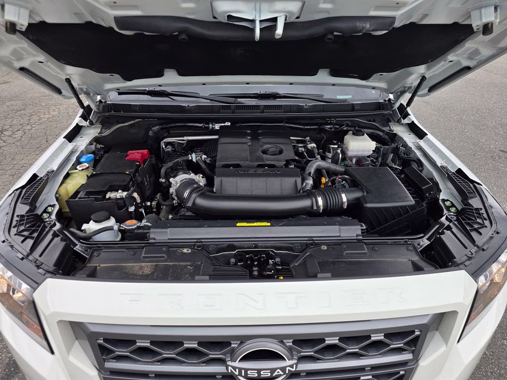 2024 Glacier White Nissan Frontier SV 4X4 Truck