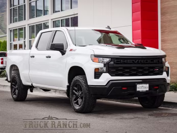 2024 Summit White Chevrolet Silverado 1500 Custom Trail Boss 4X4 Truck