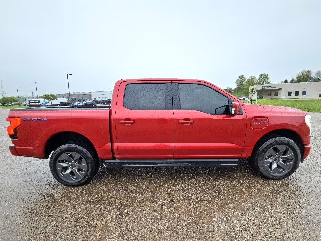 2023 Rapid Red Metallic Tinted Clearcoat Ford F-150 Lightning Lariat AWD Truck