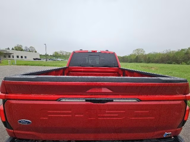 2023 Rapid Red Metallic Tinted Clearcoat Ford F-150 Lightning Lariat AWD Truck