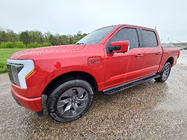 2023 Rapid Red Metallic Tinted Clearcoat Ford F-150 Lightning Lariat AWD Truck