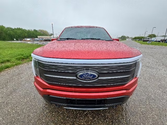 2023 Rapid Red Metallic Tinted Clearcoat Ford F-150 Lightning Lariat AWD Truck