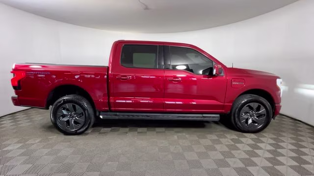 2023 Red Metallic Ford F-150 Lightning Lariat AWD Truck