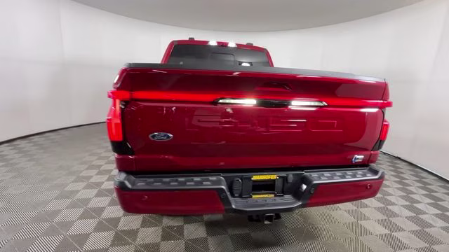 2023 Red Metallic Ford F-150 Lightning Lariat AWD Truck