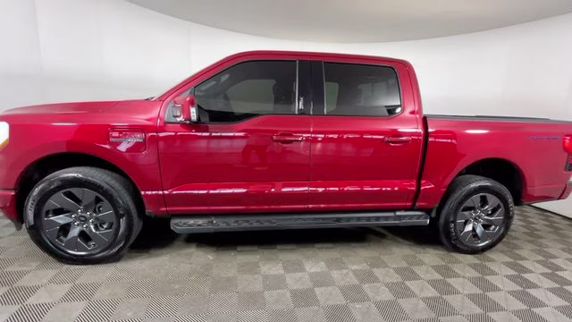 2023 Red Metallic Ford F-150 Lightning Lariat AWD Truck
