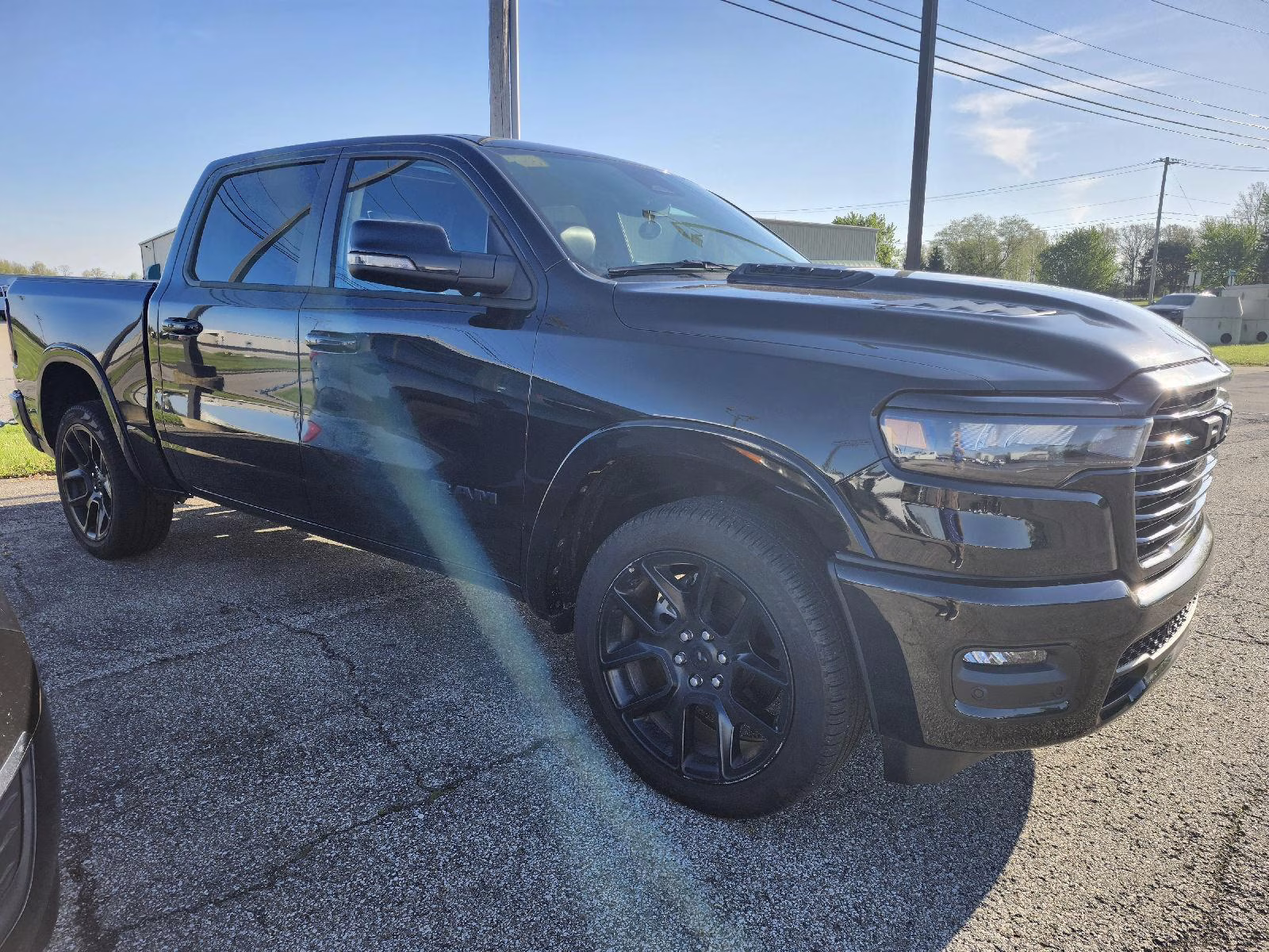 2025 Diamond Black Crystal Pearlcoat Ram 1500 Laramie 4X4 Truck