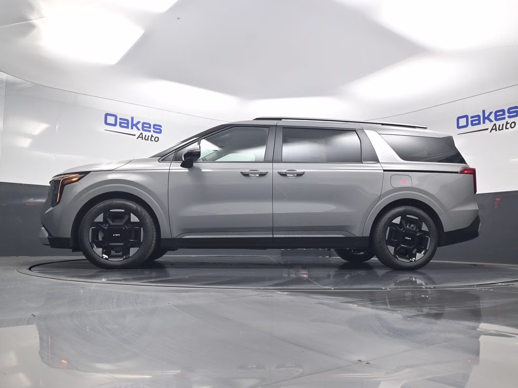 2026 Ceramic Silver Kia Carnival EX FWD Van